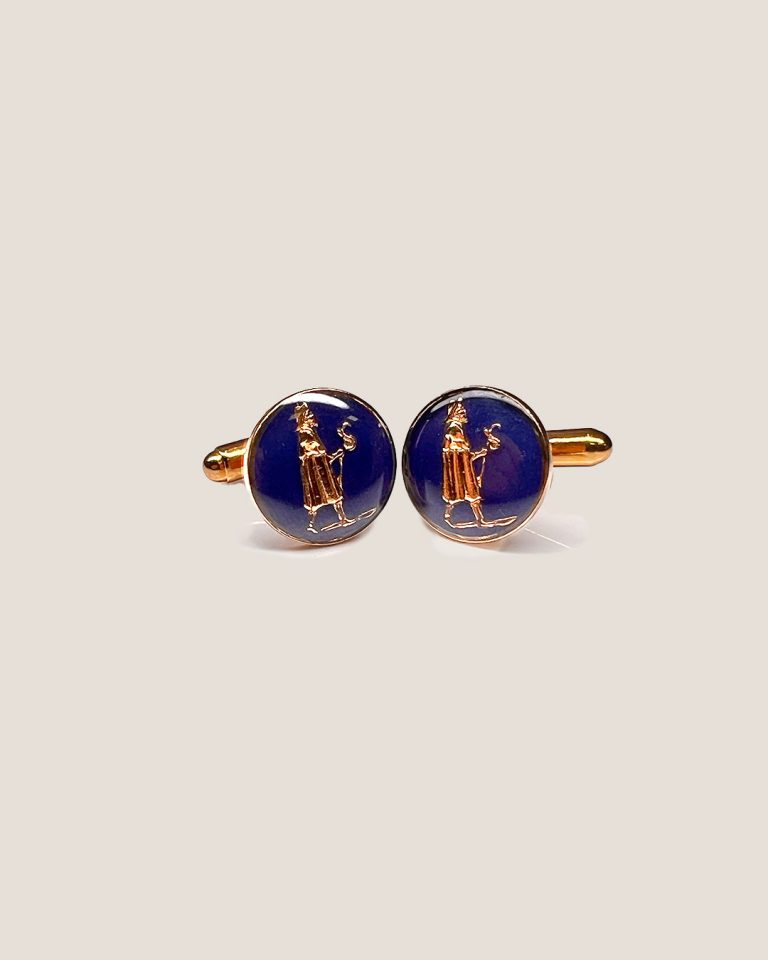 JACOBSLAND blue cufflinks made of brass with gold plating and enamel, featuring a pilgrim design inspired by the Camino de Santiago. Handcrafted by artisans with over a hundred years of tradition, perfect for special occasions.